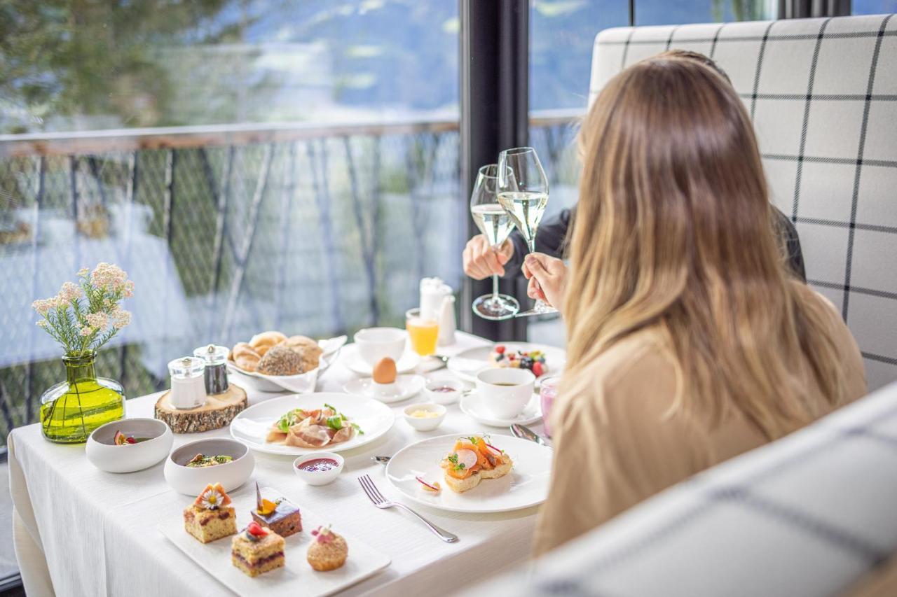 Hotel My Arbor - Dolomites Bresanona Exterior foto A woman enjoying a meal at a restaurant